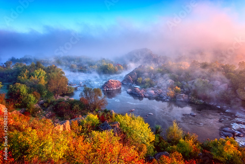 Amazing nature landscape, misty autumn sunrise over the scenic rocky canyon, National park Bugski Guard, Southern Bug river, Mykolaiv region, Ukraine