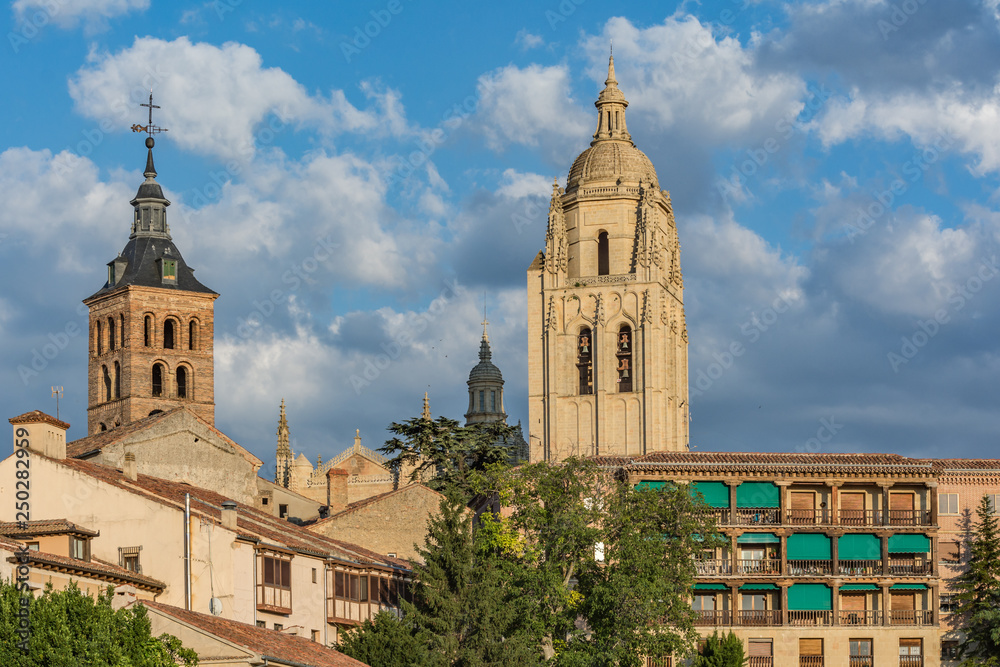 View of the Cathedral of Segovia and the Romanesque Church of San Esteban in Segovia (Spain)