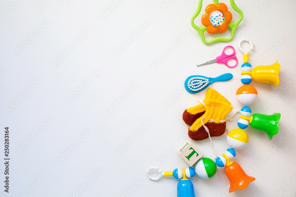 Toys for kids concept. Baby items for newborns. Copy space and top view.