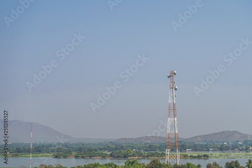 Mobile phone communication tower transmission signal with blue sky background