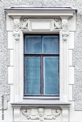 Rectangular window on a gray wall.