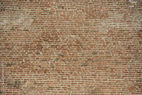 Old brick wall background made of red bricks