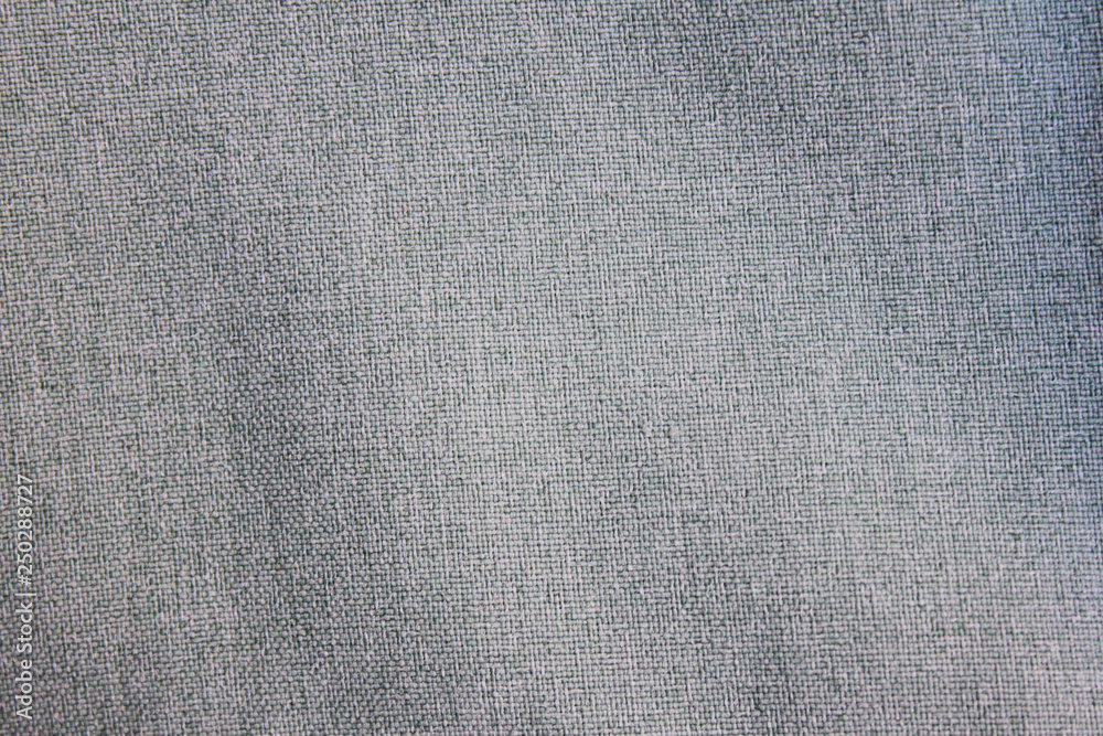 Fototapeta premium Fabric texture background of simple smooth grey satin shirt. Gray cloth pattern surface, casual material design, close up top view with empty seamless copy space on classic shirt