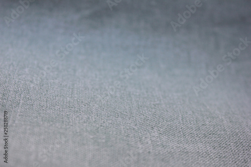 Gradient Grey Texture Background of  Seamless Empty Fabric, Close Up Top View. Washy Faded Fabric Backdrop, Empty Simple Canvas Design to Use as Copy Space, Template, Layout, Mock Up or Banner © onajourney