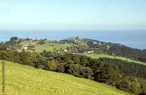 Meadows in rural village in the spanish basque country in a sunny day. photo