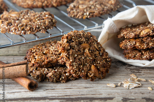 Homemade cookie with oat flakes, nuts and quinoa. Wholegrain cookies. healthy snack or dessert. photo