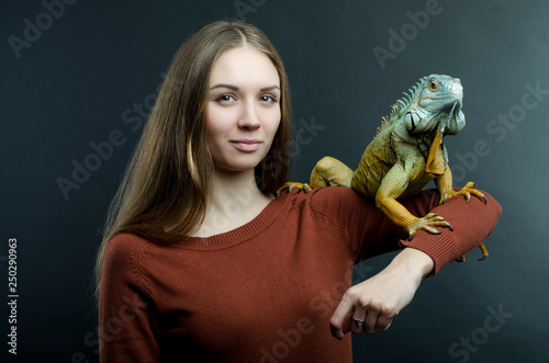 beautiful woman and green iguana 