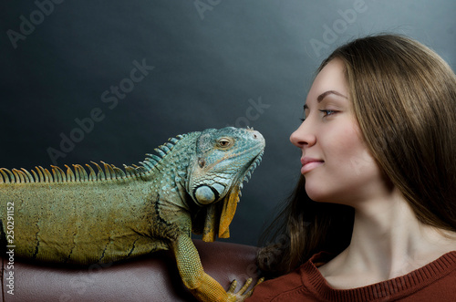 beautiful woman and green iguana 