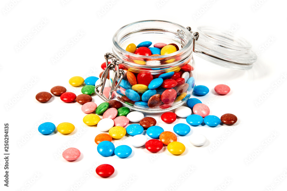 Colorful candies in glass jar isolated on white Colorful candies in glass jar isolated on white