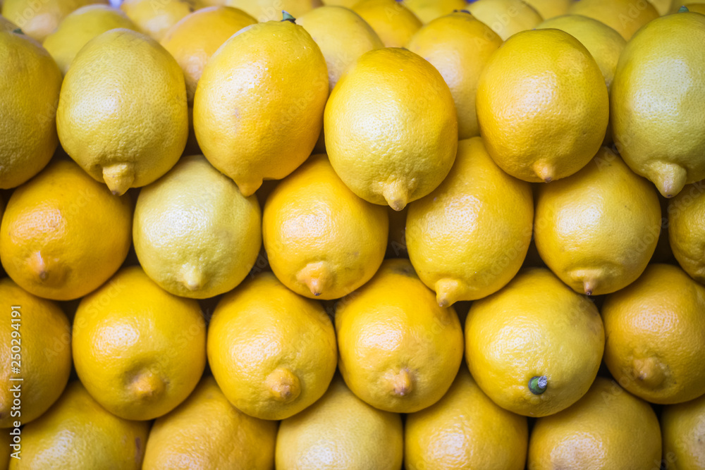 Pile of bright fresh yellow lemons