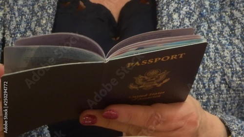 US passport in female hands. Flipping US passport