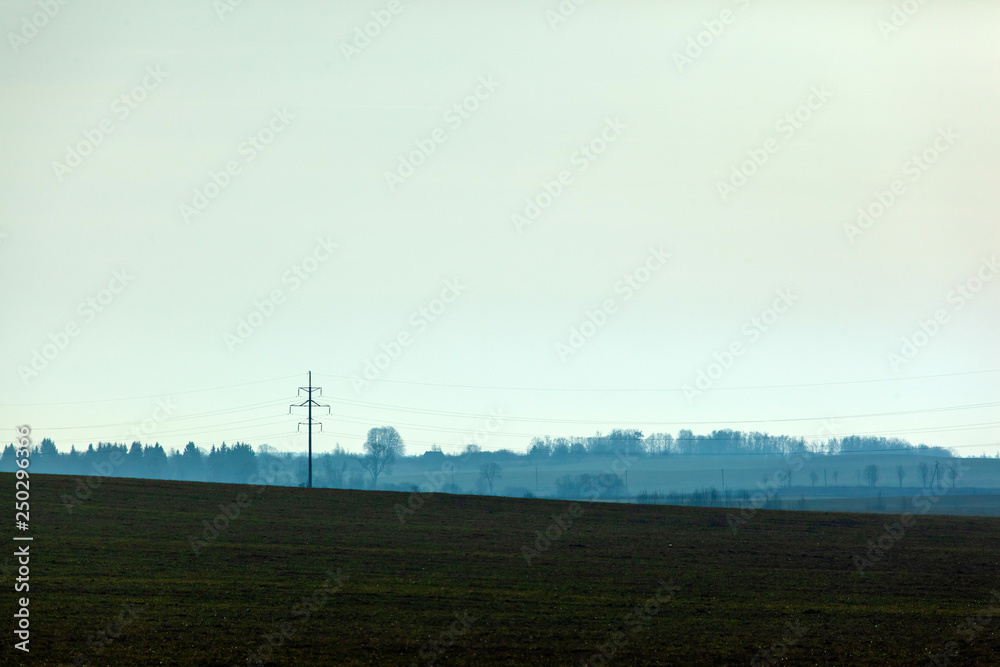 mystical mysterious landscape of a field in with the silhouette of a forest in haze mystical mysterious landscape of a field in with the silhouette of a forest in haze