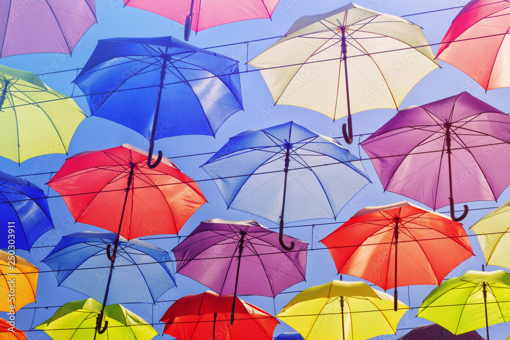 Colorful umbrellas on the sky background, toned. Colorful umbrellas on the sky background, toned.