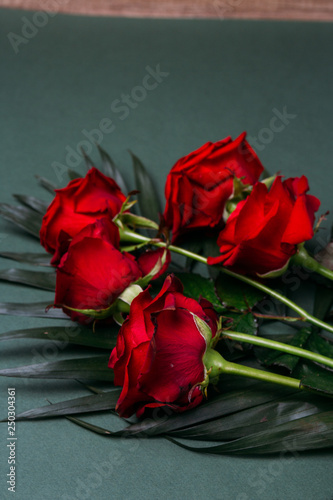 red roses on green background present mothers