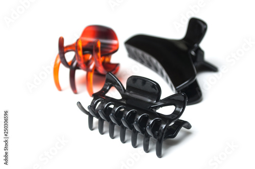 group of plastic hair clips on white background photo