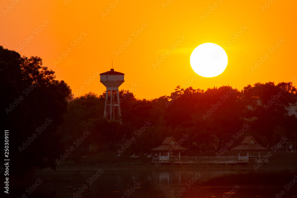 Sunset in the lake. beautiful sunset behind the clouds above the over lake landscape background. dramatic sky with cloud at sunset - Image Sunset in the lake. beautiful sunset behind the clouds above the over lake landscape background. dramatic sky with cloud at sunset - Image