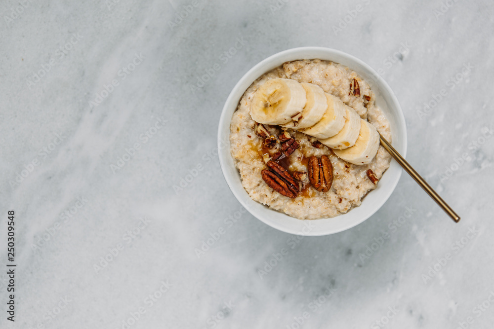 Fototapeta premium Oatmeal with berries and nuts. Concept healthy breakfast.
