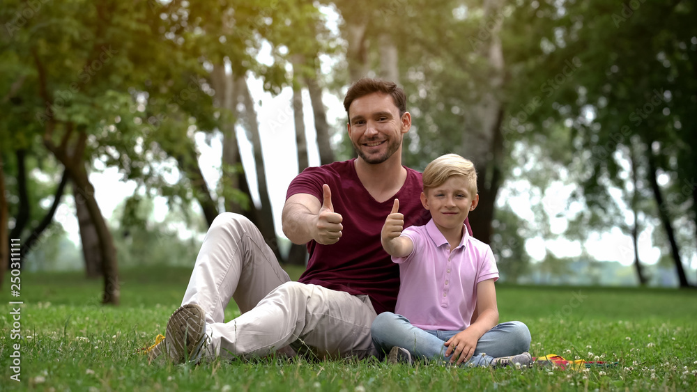 Man and boy show thumbs up, social support for single parent family, wellbeing Man and boy show thumbs up, social support for single parent family, wellbeing