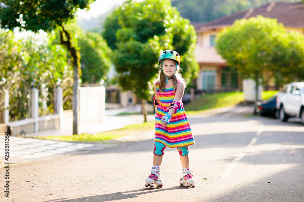 Child on inline skates. Kids skate roller blades. Child on inline skates. Kids skate roller blades.