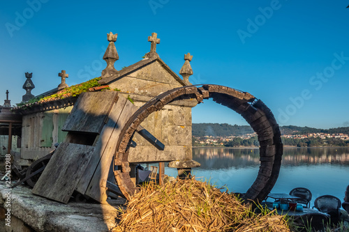 The beautiful old village of Combarro, near Sanxenxo, Pontevedra, Galicia, Spain. It has an outstanding collection of horreos (granaries) and cruceiros (calvary sculptures). photo