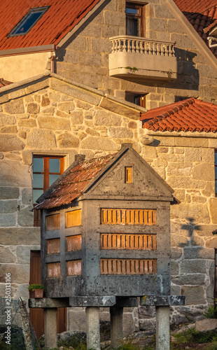 The beautiful old village of Combarro, near Sanxenxo, Pontevedra, Galicia, Spain. It has an outstanding collection of horreos (granaries) and cruceiros (calvary sculptures). photo