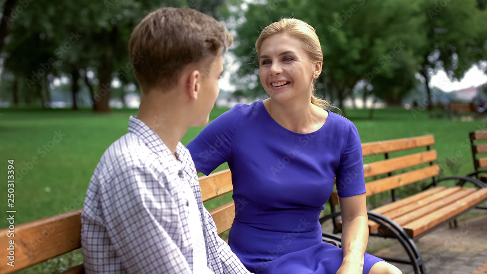 College-bound son telling funny stories to his mother, spending weekend together College-bound son telling funny stories to his mother, spending weekend together