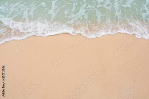 Soft wave of sea on empty sandy beach Background with copy space © Achira22