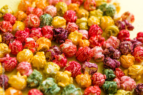 multi-colored popcorn on a bright background.concept of cinema,copy spase