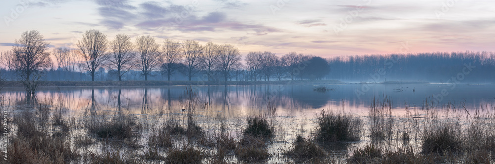 Early morning winter sunrise over lake, Broekpolder, Vlaardingen