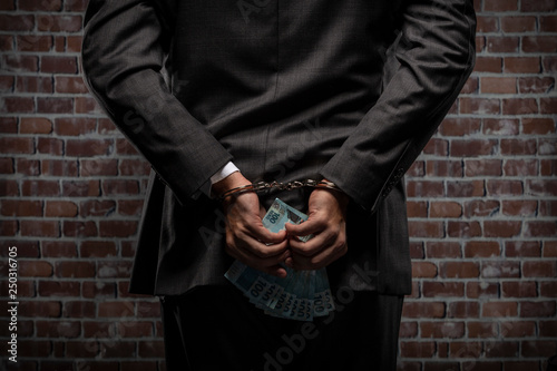 Corrupt man holding bills of money