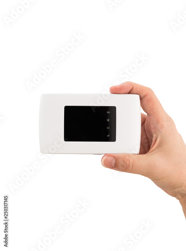 Portable usb router on a white background. 4g router in hand on a white background.
