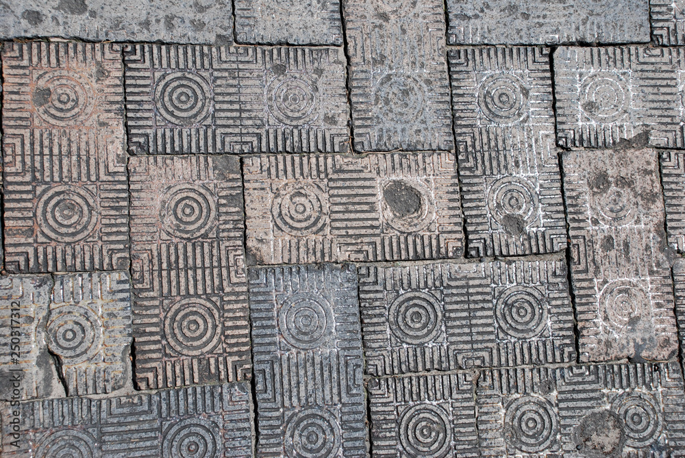 Obraz premium Close-up of dirty, patterned brick street paver detail on a Savannah, Georgia, street