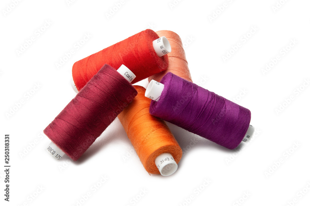Multicolored threads spools isolated Multicolored threads spools isolated