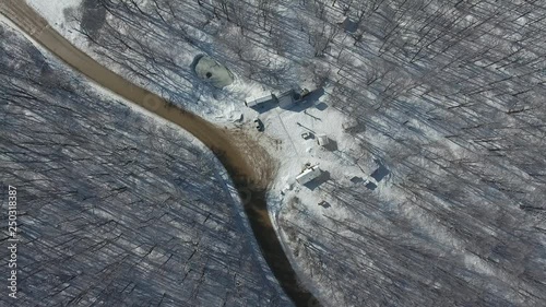 Top view of a winding road in a snowy mountain forest photo