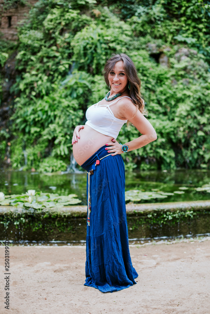 pregnant happy and smiling in the field pregnant happy and smiling in the field