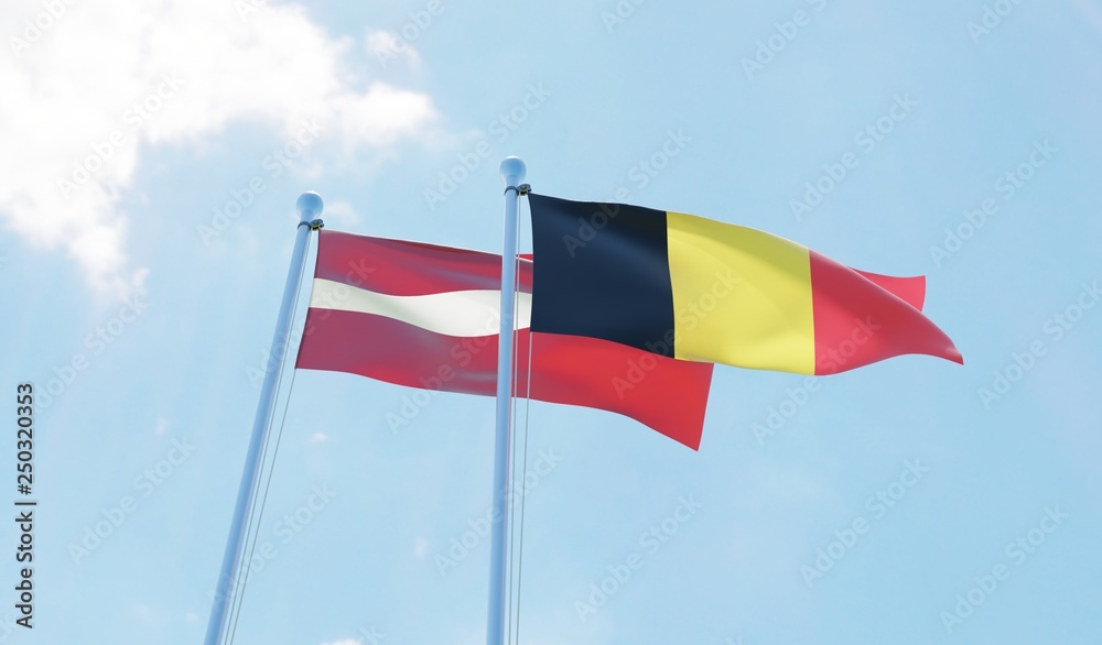 Latvia and Belgium, two flags waving against blue sky. 3d image