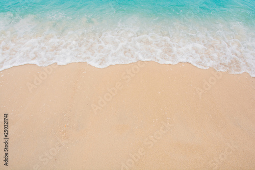 Soft wave of sea on empty sandy beach Background with copy space