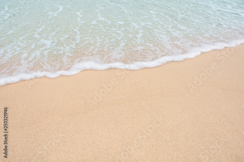 Soft wave of sea on empty sandy beach Background with copy space © Achira22