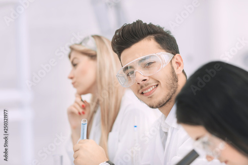 close up.a group of young scientists conduct experiments in the laboratory.