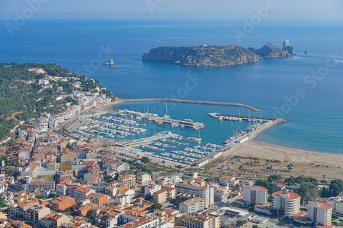Spain aerial view of l'Estartit town and harbor on the Costa Brava with the Medes islands marine reserve, Mediterranean sea, Catalonia photo