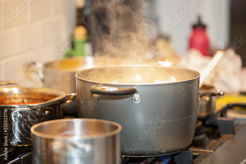 Konstfotografi Pots cooking on stove with steam