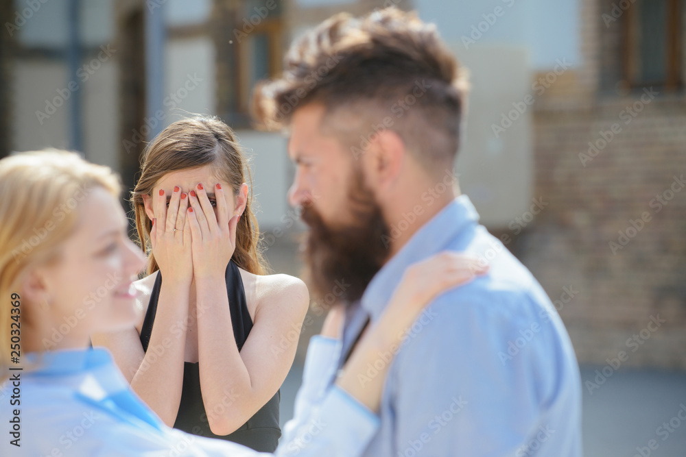 Jealous of their love. Jealous girl look at couple in love on street. Bearded man cheating his woman with another girlfriend. Unhappy woman feeling jealous. Romantic couple of man and woman dating Jealous of their love. Jealous girl look at couple in love on street. Bearded man cheating his woman with another girlfriend. Unhappy woman feeling jealous. Romantic couple of man and woman dating