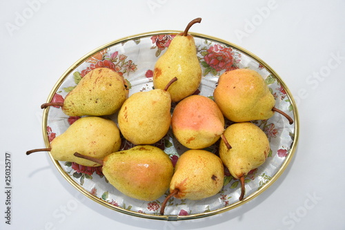 yellow pear on a  plate