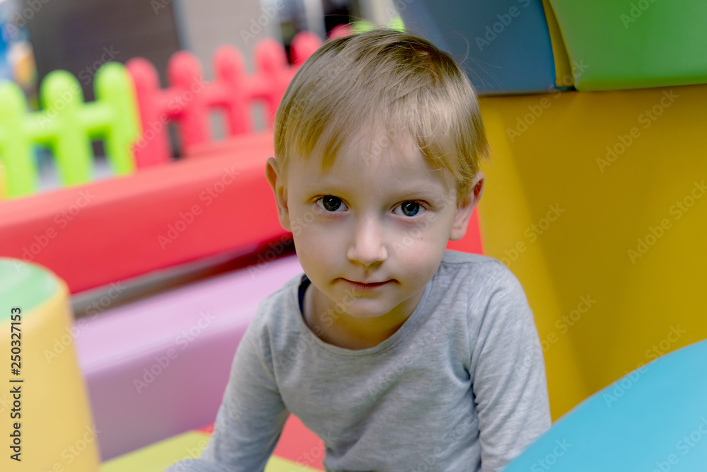 Kid playing at new playground kindergarten. Four years european Kid playing at new playground kindergarten. Four years european
