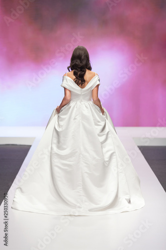 Bride walking away in a wedding dress