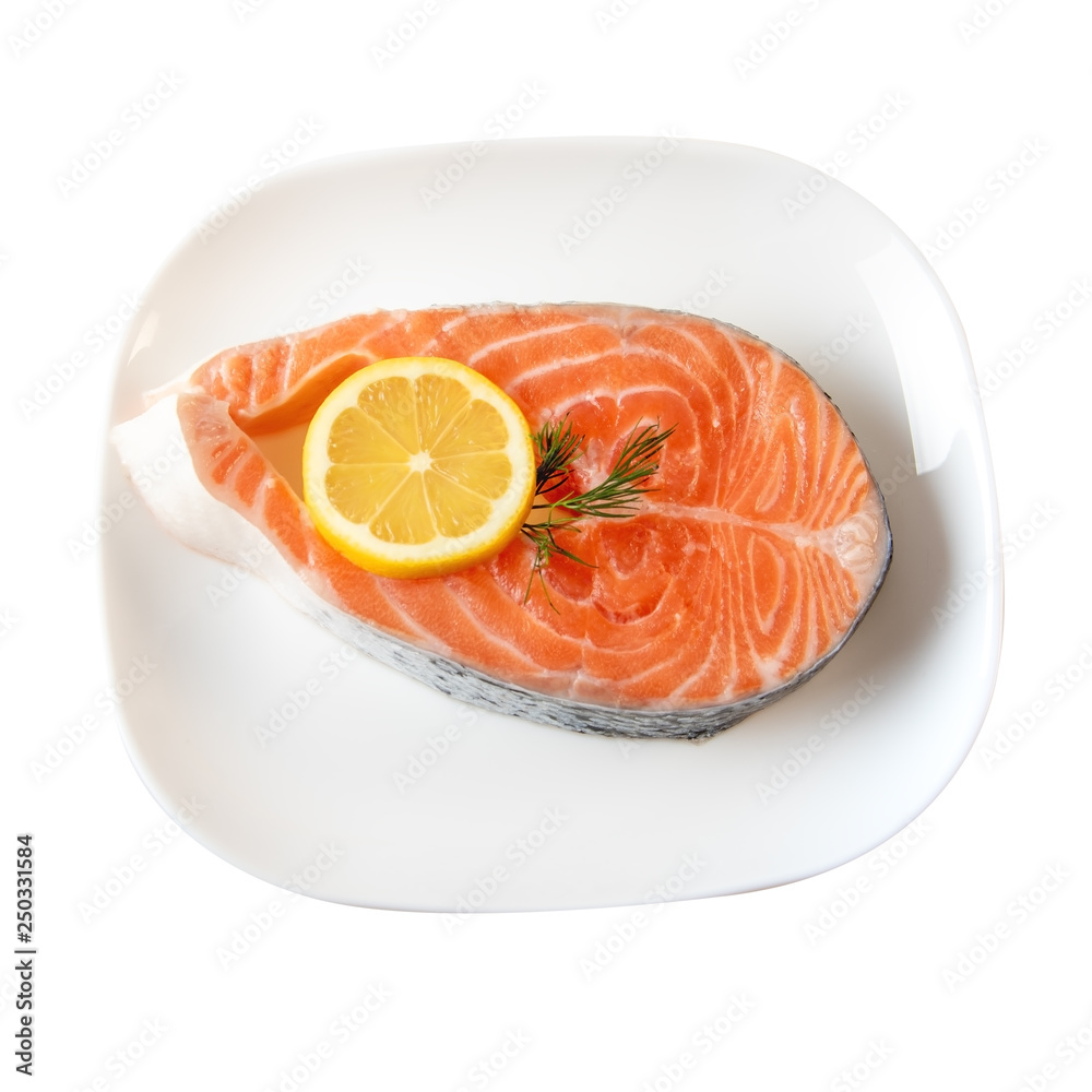 Fresh Salmon Steak On Dinner Plate Wih Lemon Slices Isolated On White. Clipping Path incluted Fresh Salmon Steak On Dinner Plate Wih Lemon Slices Isolated On White. Clipping Path incluted