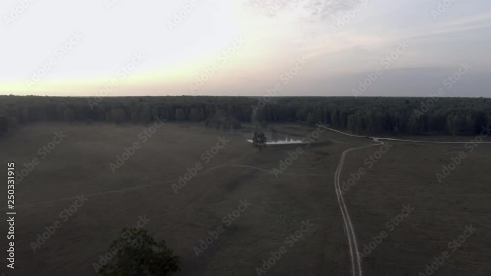 The morning field by a drone, pond The morning field by a drone, pond