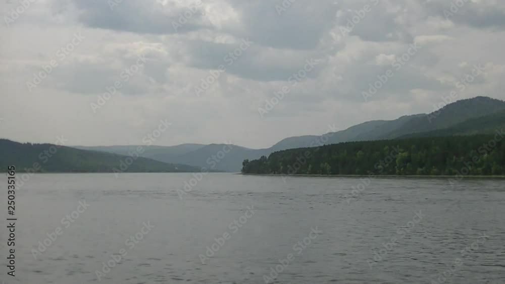 Big river, dense forest on the banks Big river, dense forest on the banks