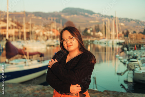 Outdoor portrait of asian plus size model posing by the lake