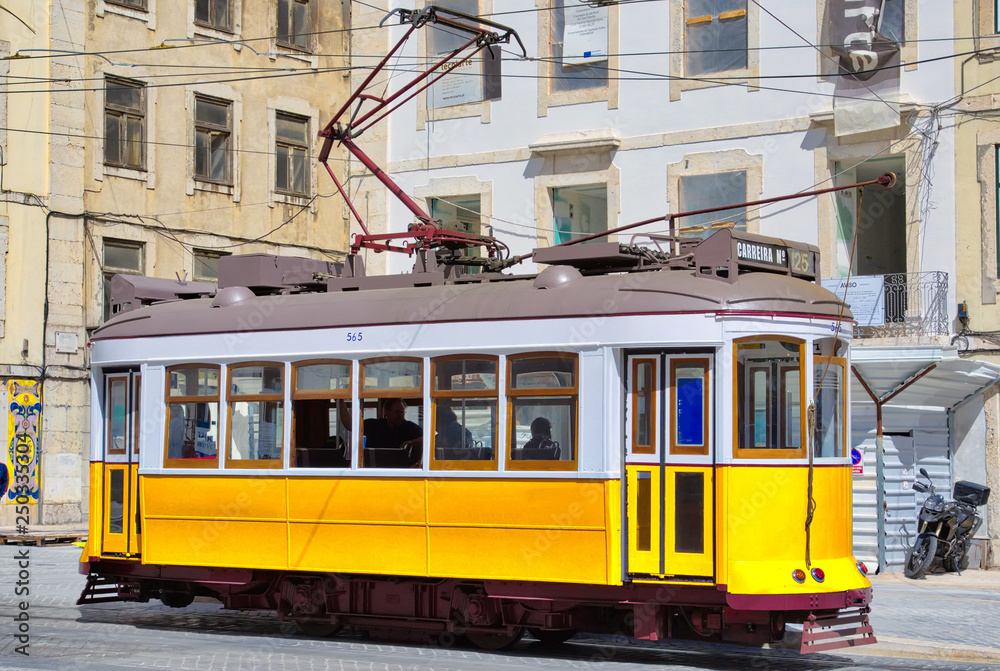 Naklejka premium Lisbon, Portugal-17 October, 2017: Famous yellow Lisbon tram lines, a landmark Lisbon tourist attraction